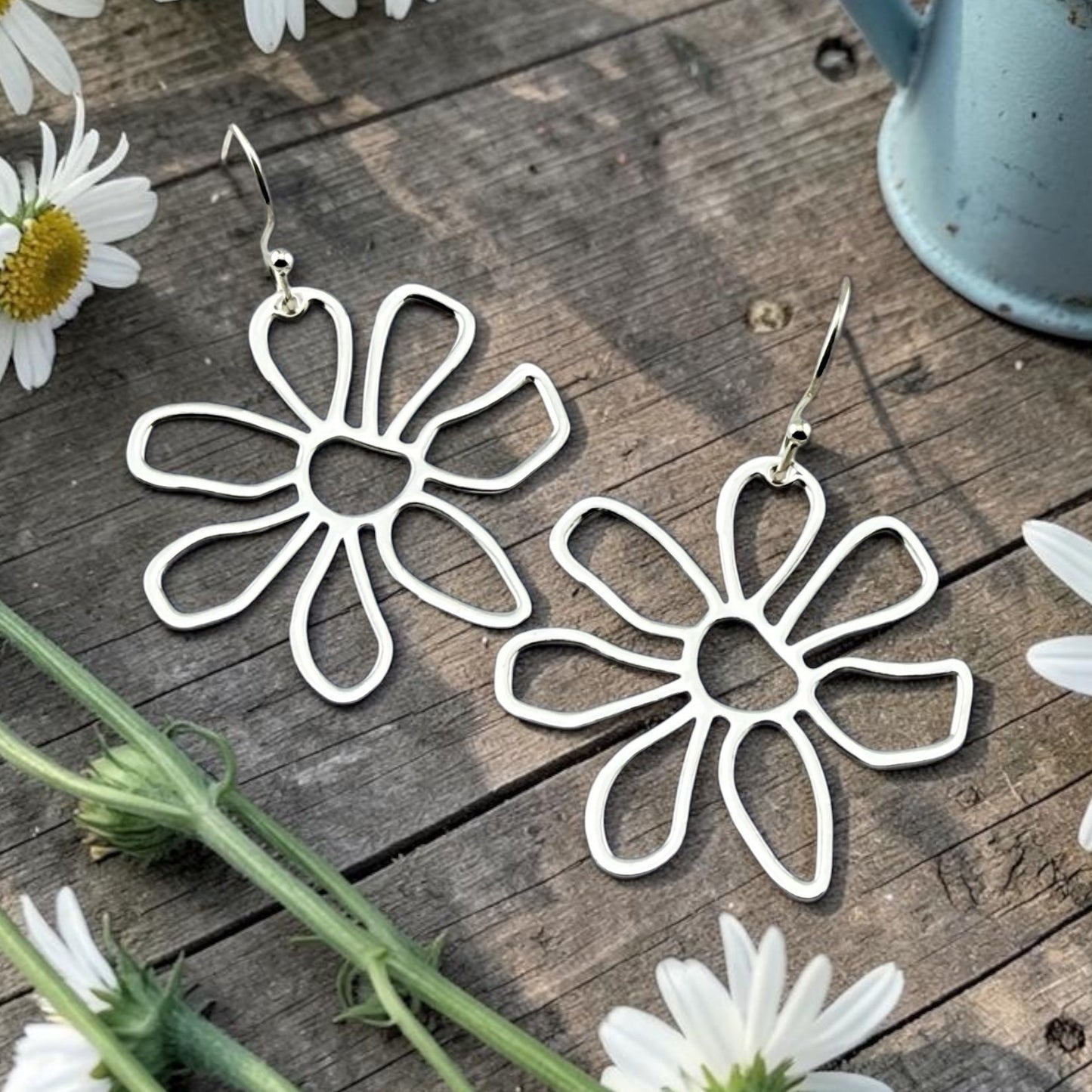 Silver daisy floral earrings with lightweight open petal design by Half Turn Designs