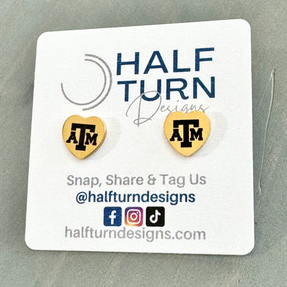 Heart-Shaped Texas A&M Stainless Steel Earring Studs engraved with the Texas A&M logo in gold or silver finish by Half Turn Designs, officially licensed with Texas A&M University.