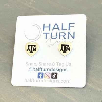 Heart-Shaped Texas A&M Stainless Steel Earring Studs engraved with the Texas A&M logo in gold or silver finish by Half Turn Designs, officially licensed with Texas A&M University.