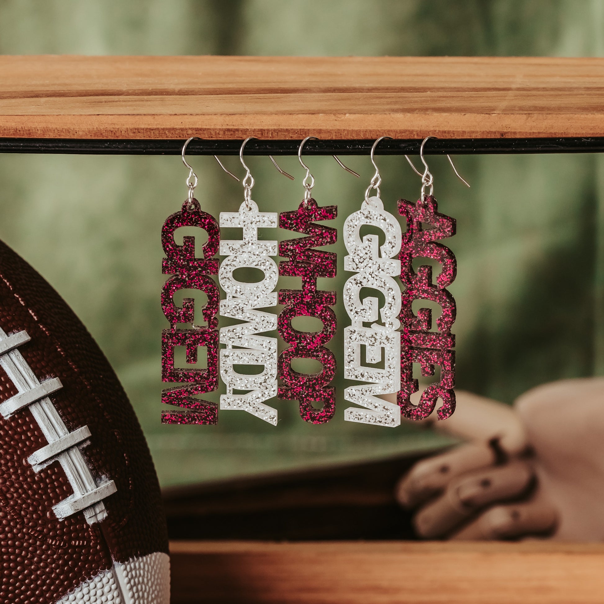 Texas A&M University mini mix & match dangles earrings in maroon and white glitter.  Phrases available include aggies, gig 'em, howdy and whoop