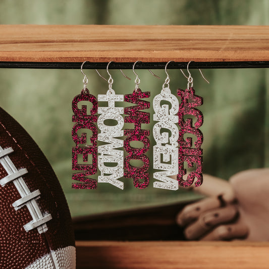 Texas A&M University mini mix & match dangles earrings in maroon and white glitter.  Phrases available include aggies, gig 'em, howdy and whoop