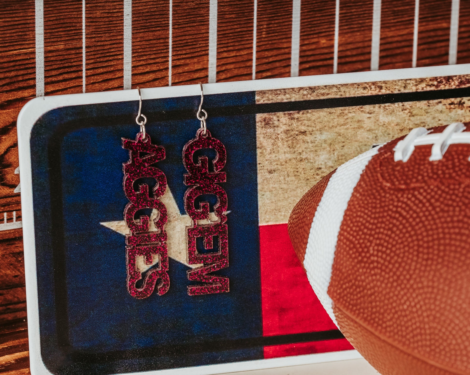 Texas A&M University mini mix & match dangles earrings in maroon and white glitter.  Phrases available include aggies, gig 'em, howdy and whoop