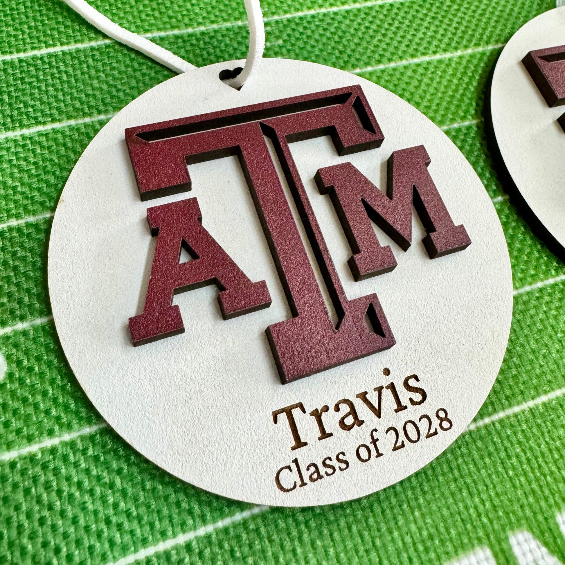 Texas A&M personalized wooden ornament. Available in four wood types - Cherry, Mahogany, Walnut and White wood. Officially licensed by Half Turn Designs.