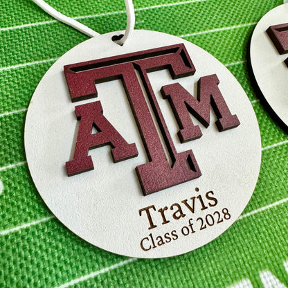 Texas A&M personalized wooden ornament. Available in four wood types - Cherry, Mahogany, Walnut and White wood. Officially licensed by Half Turn Designs.