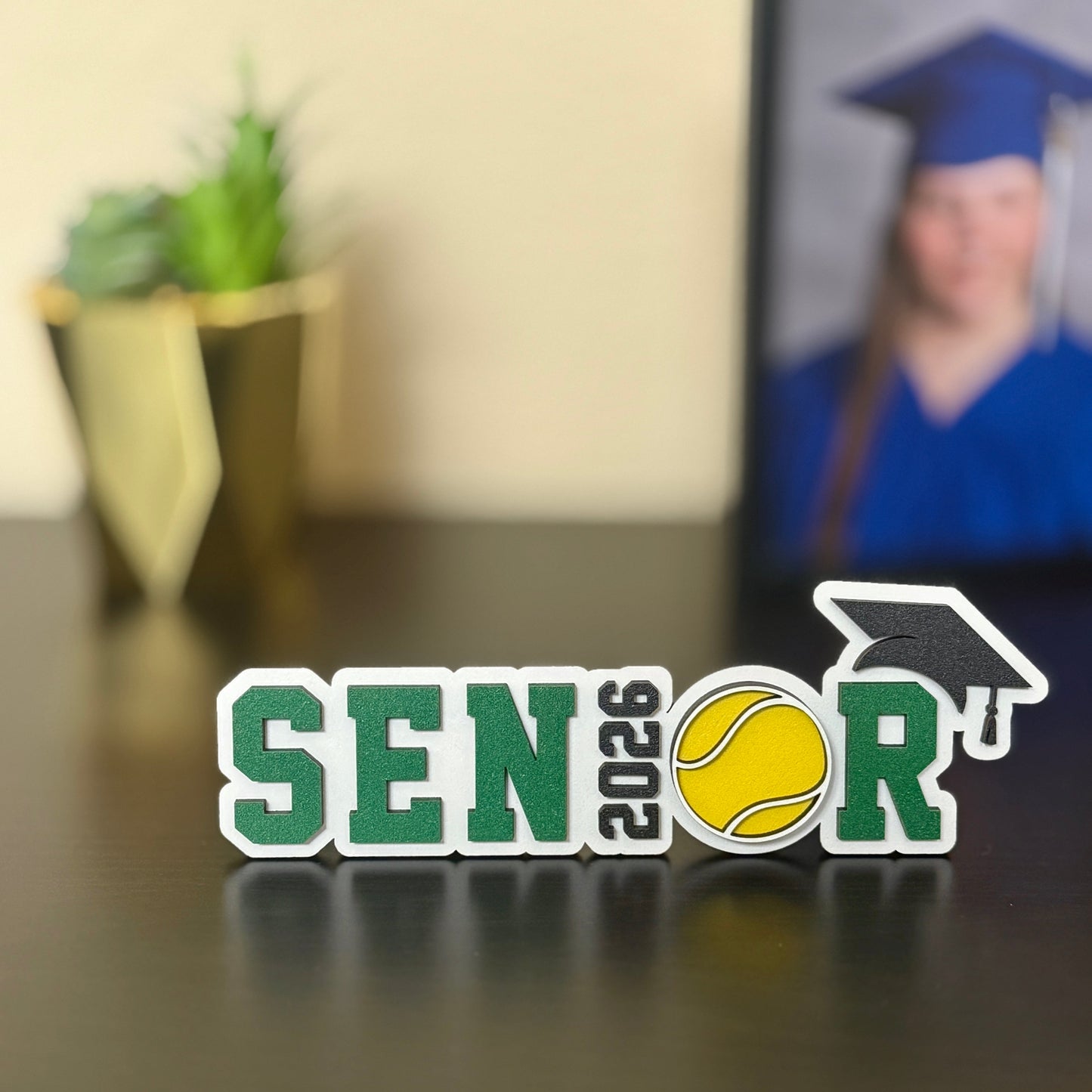 Tennis graduation sign for Class of 2026 high school senior - made of wood and available in 14 school colors.