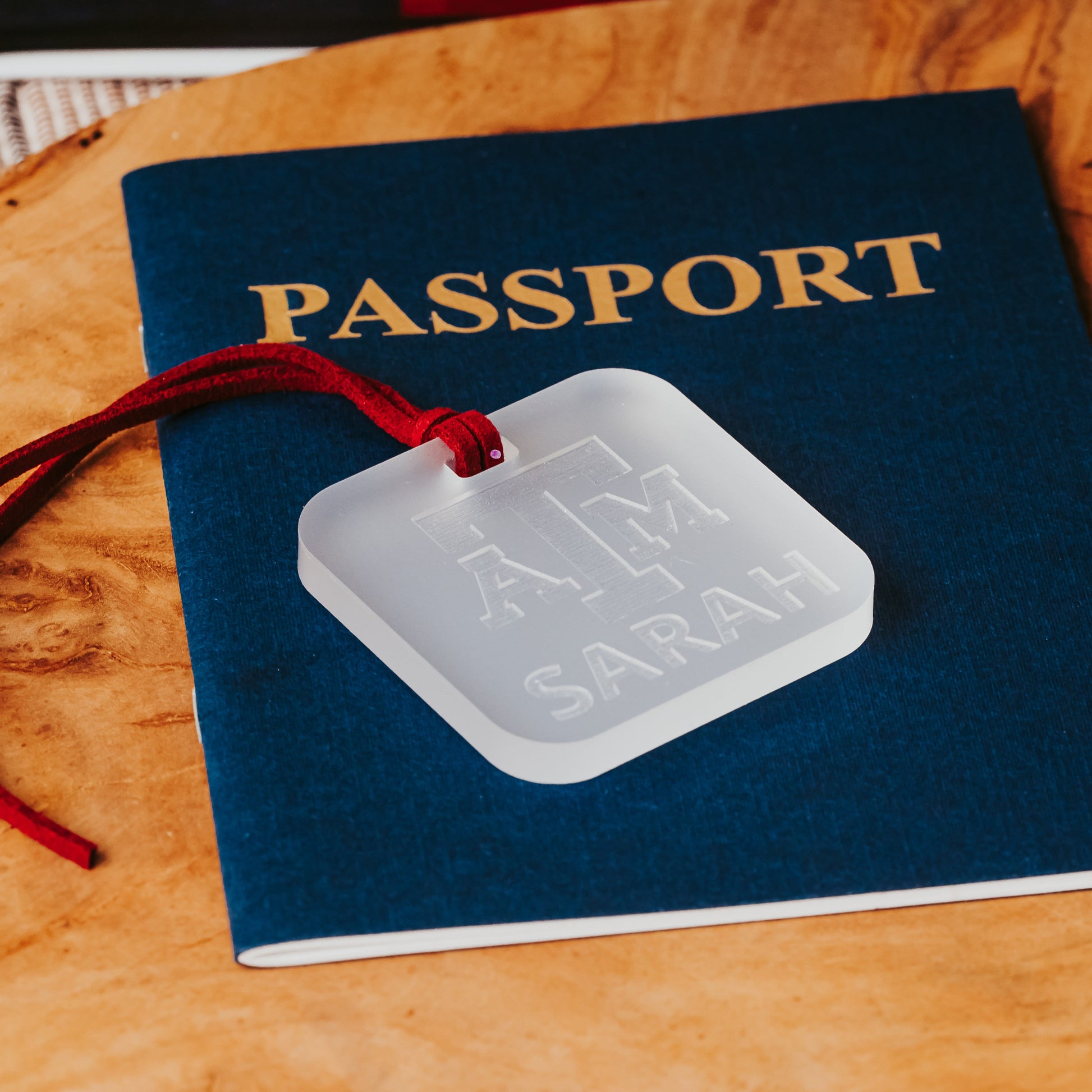 Officially licensed Texas A&M luggage tags in square shape, 2x2".  These acrylic luggage tags are personalized with 1-2 lines of text and come in 1/8" or 1/4" width.  Luggage tag colors include Clear, Frosted, Opaque Black, Shiny Black, Maroon that engraves white and Black that engraves white.  Frosted acrylic version shown here.