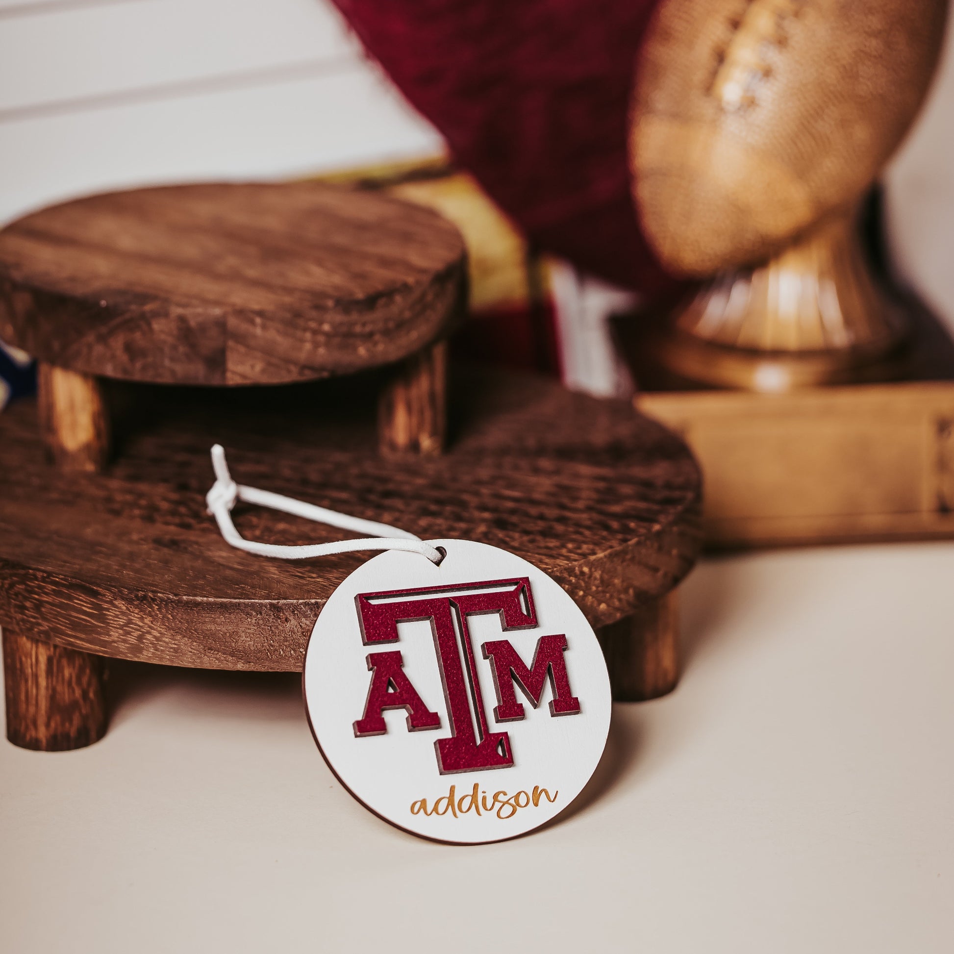 Texas A&M personalized wooden ornament. Available in four wood types - Cherry, Mahogany, Walnut and White wood. Officially licensed by Half Turn Designs.  Shown here in White wood