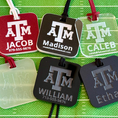 Officially licensed Texas A&M luggage tags in square shape, 2x2".  These acrylic luggage tags are personalized with 1-2 lines of text and come in 1/8" or 1/4" width.  Luggage tag colors include Clear, Frosted, Opaque Black, Shiny Black, Maroon that engraves white and Black that engraves white.
