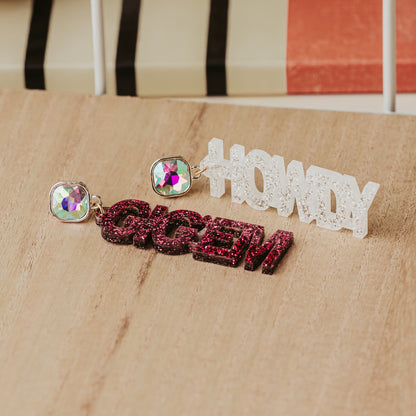 Texas A&M Officially Howdy and Gig'em dangle earrings in maroon and white glitter acrylic with AB Iridescent stud toppers.
