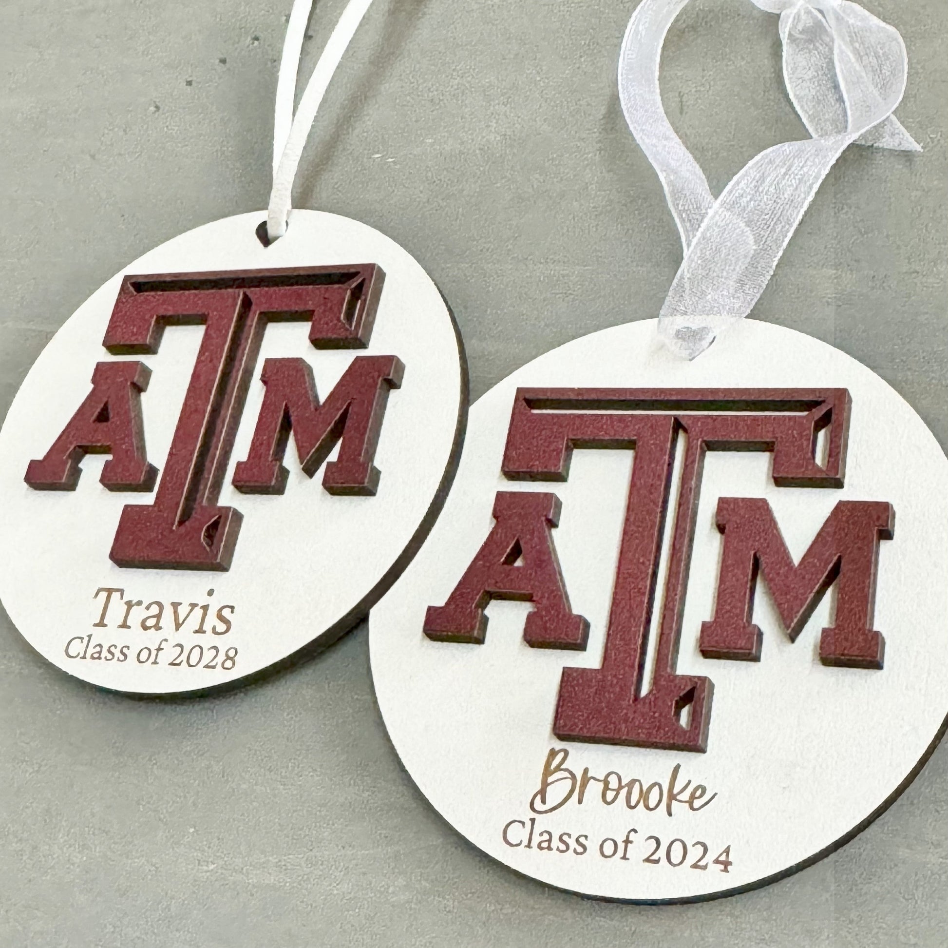 Texas A&M personalized wooden ornament. Available in four wood types - Cherry, Mahogany, Walnut and White wood. Officially licensed by Half Turn Designs.