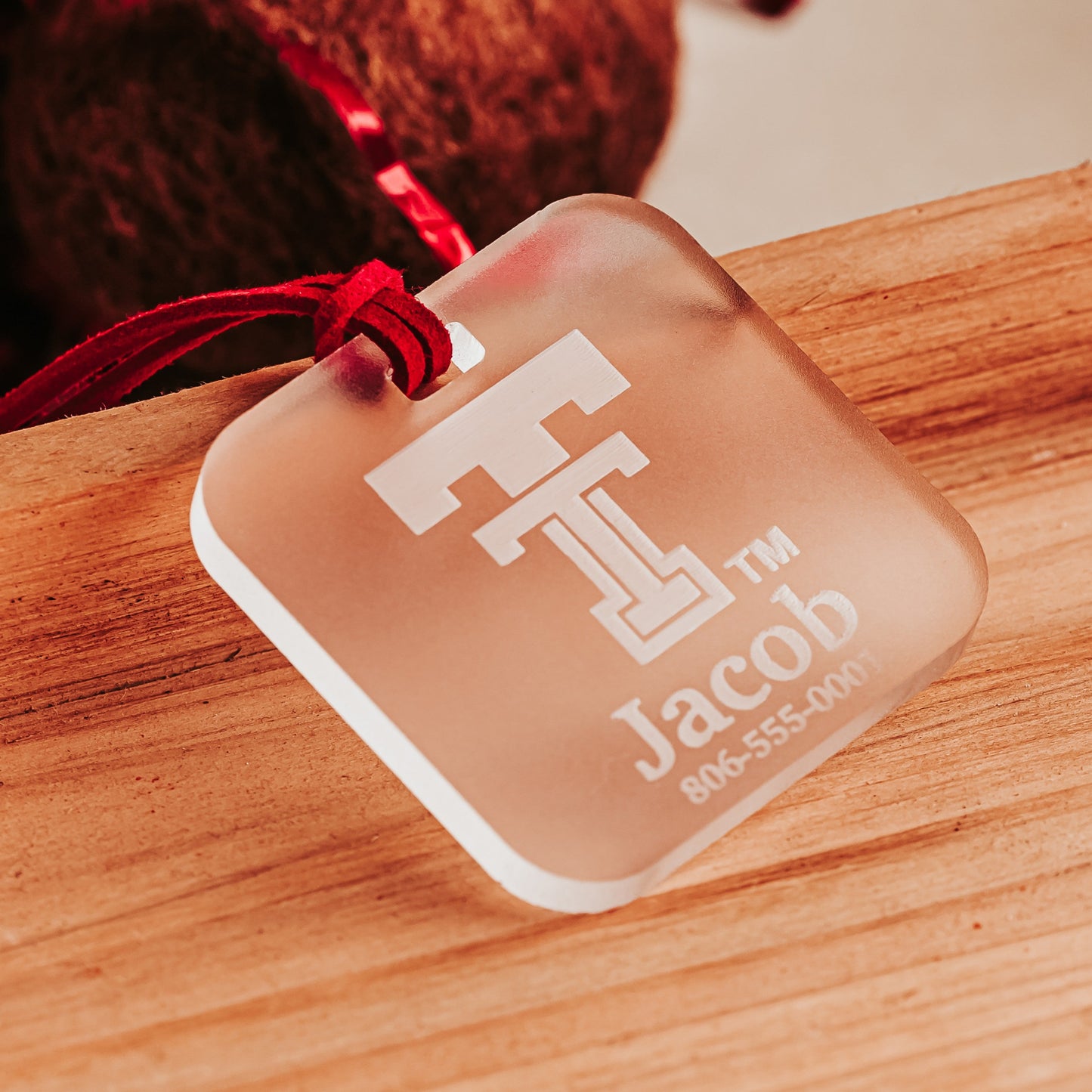 Personalized frosted Texas Tech acrylic luggage tag with Double T logo, name and phone number