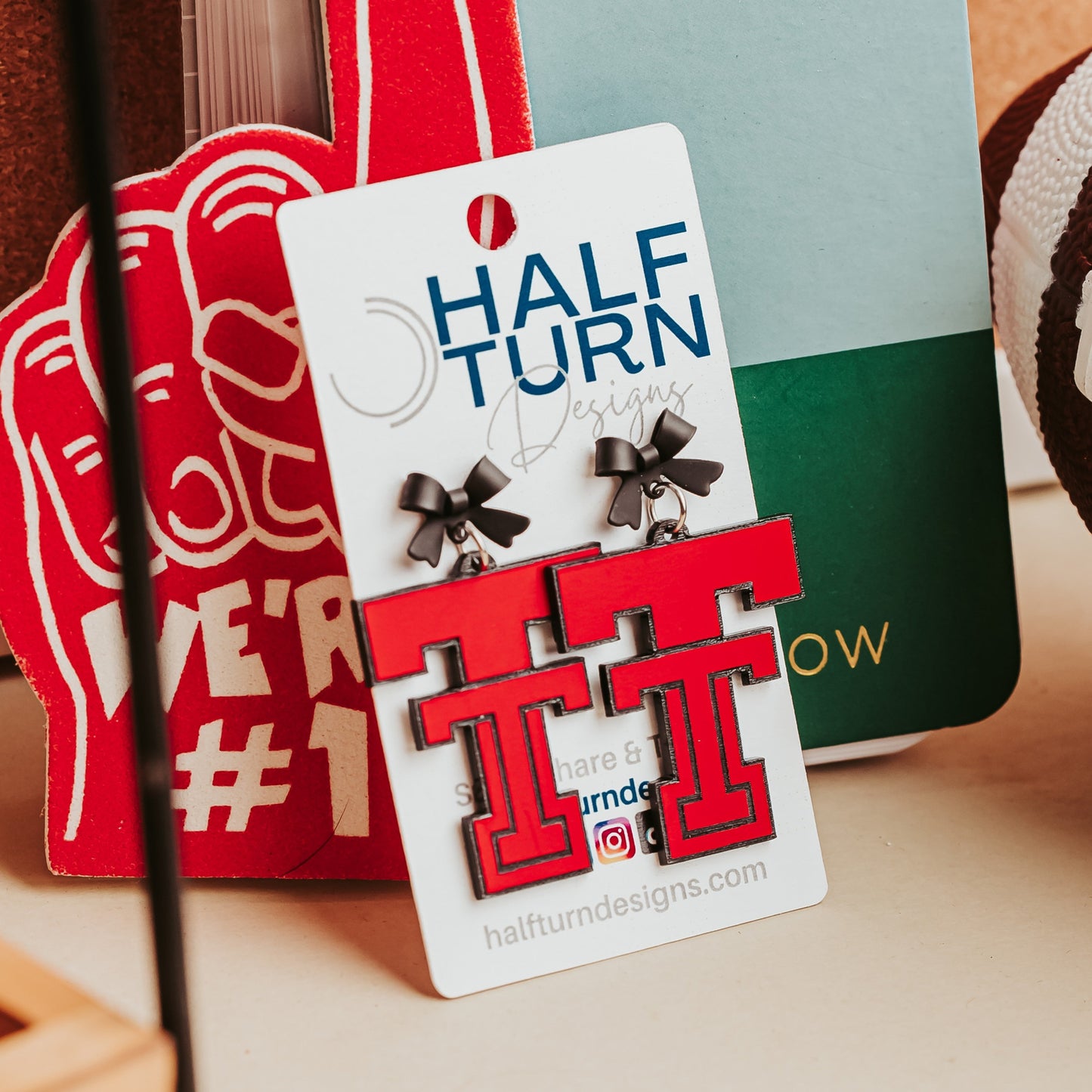 Texas Tech Red Raiders Black and Red Acrylic Game Day earrings with Black Bow studs, officially licensed by Half Turn Designs