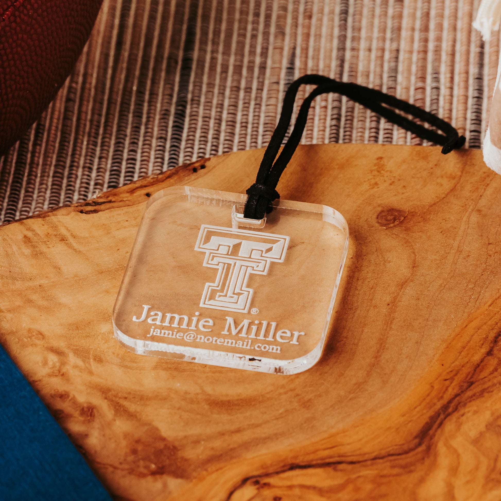Officially Licensed Texas Tech University luggage tags featuring the TTU logo, personalized with customer's choice of 1-3 lines of information. Available in Clear, Frosted and Opaque Black acrylic by Half Turn Designs.  Shown here in clear acrylic.