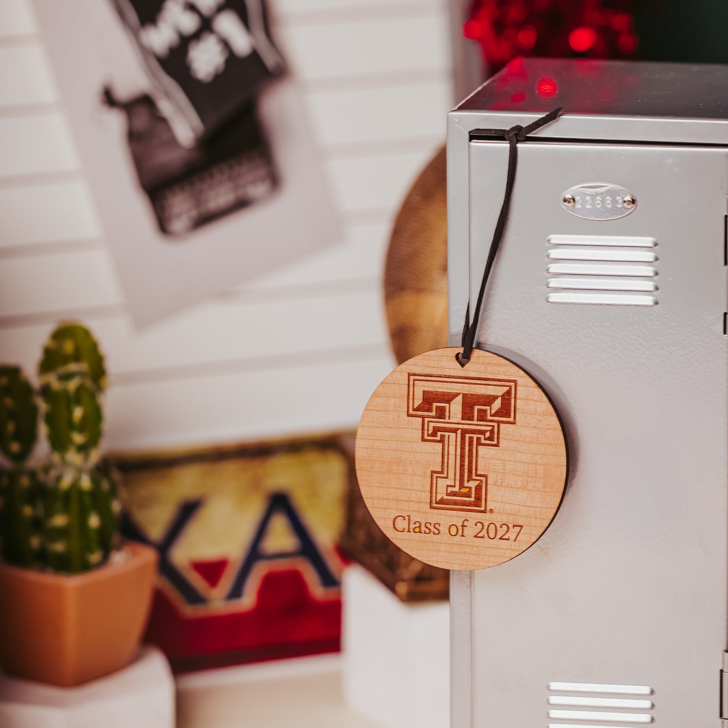 Officially Licensed Texas Tech University round wooden ornament with engraved TTU logo and 1-2 lines of personalized text. Available in cherry, mahogany or white wood finishes.