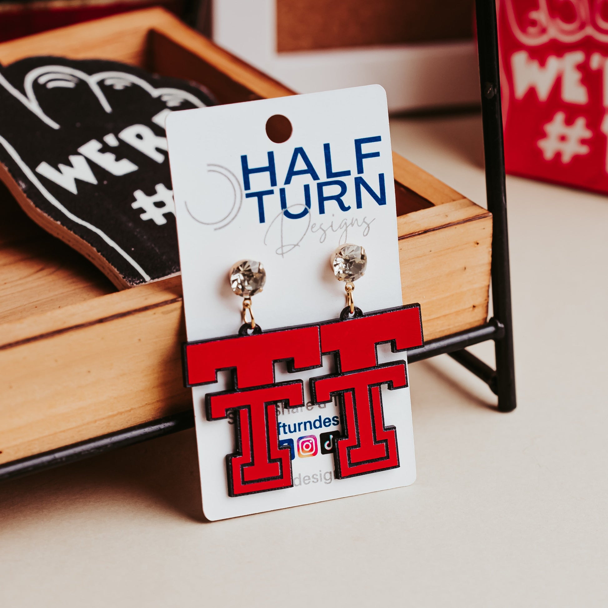 Officially Licensed Texas Tech game day earrings in red acrylic that engraves black with rhinestone studs.