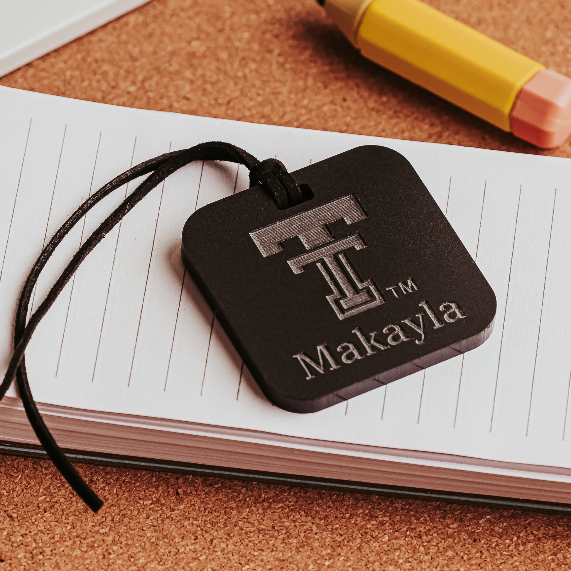 Personalized black Texas Tech acrylic luggage tag with = Double T logo and name