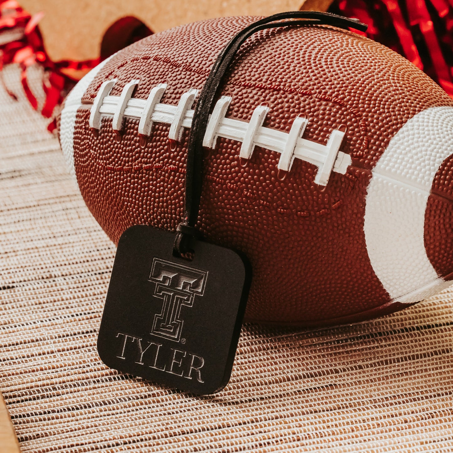 Officially Licensed Texas Tech University luggage tags featuring the TTU logo, personalized with customer's choice of 1-3 lines of information. Available in Clear, Frosted and Opaque Black acrylic by Half Turn Designs.  Shown here in opaque black acrylic.