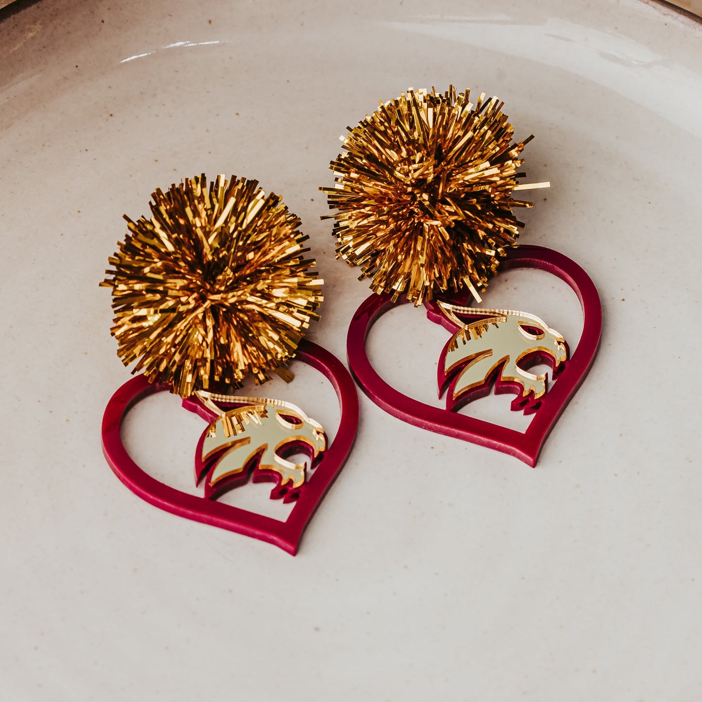 TXST Maroon & Gold Heart Acrylic Earrings with Gold Tinsel Studs.