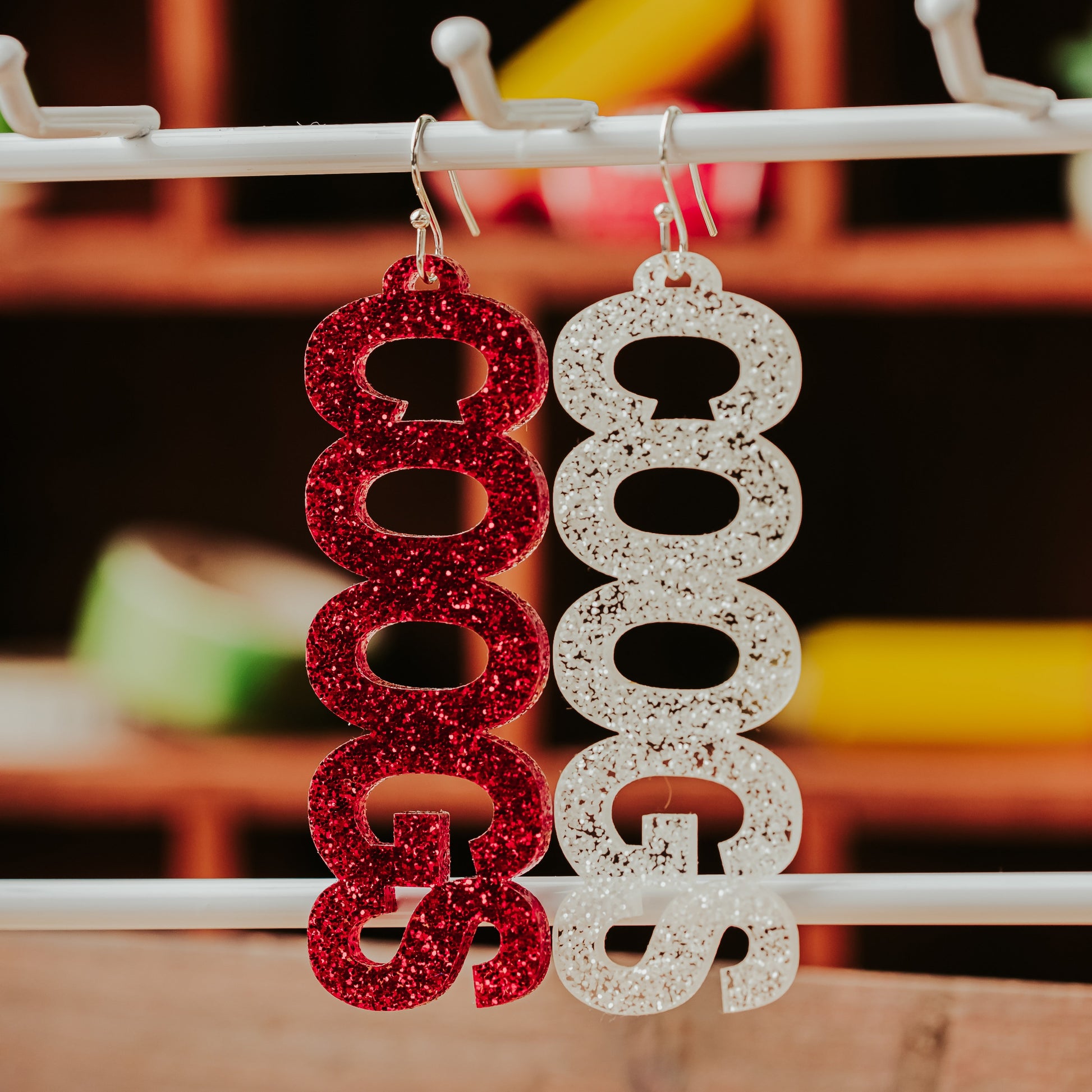 University of Houston COOGS earrings in red and white glitter acrylic with silver tone earring hooks by Half Turn Designs
