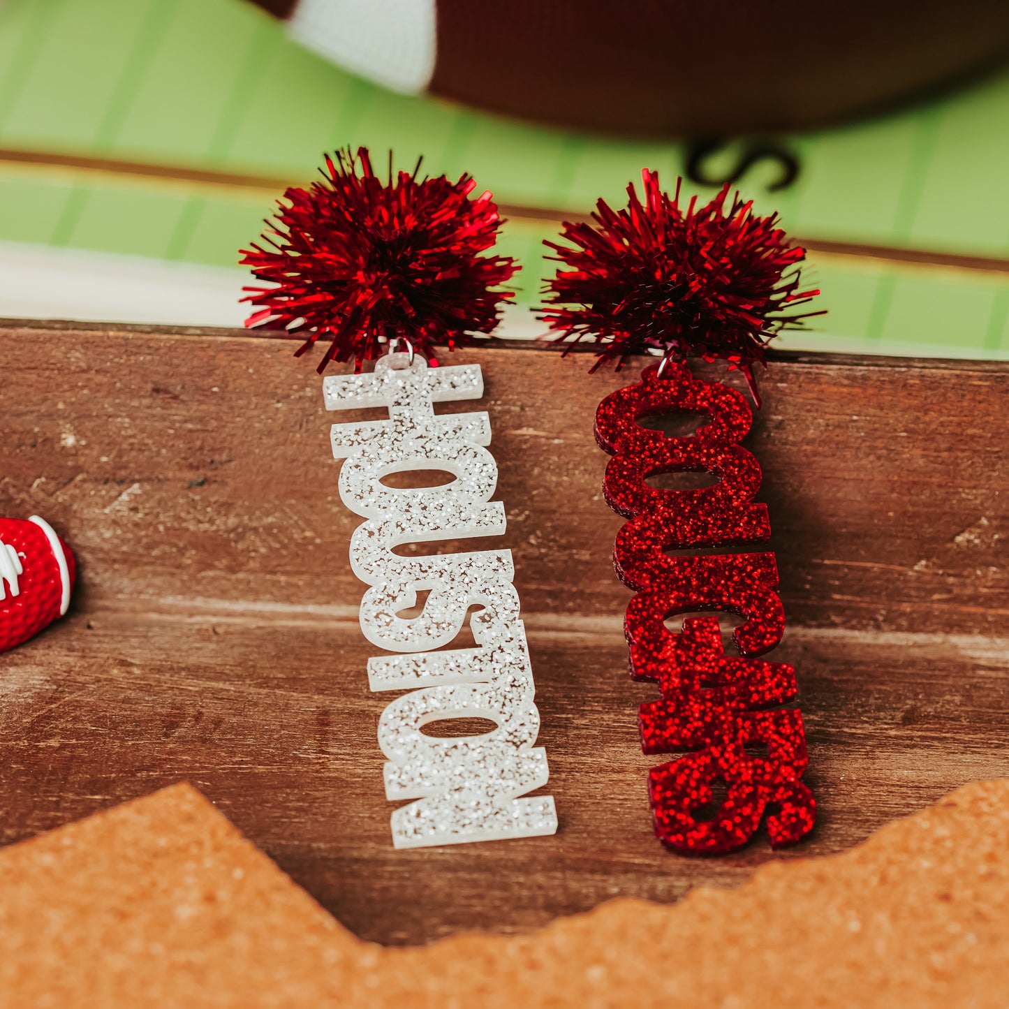 Officially Licensed University of Houston Cougars acrylic dangle earrings in red and white glitter with  tinsel earring toppers by Half Turn Designs.