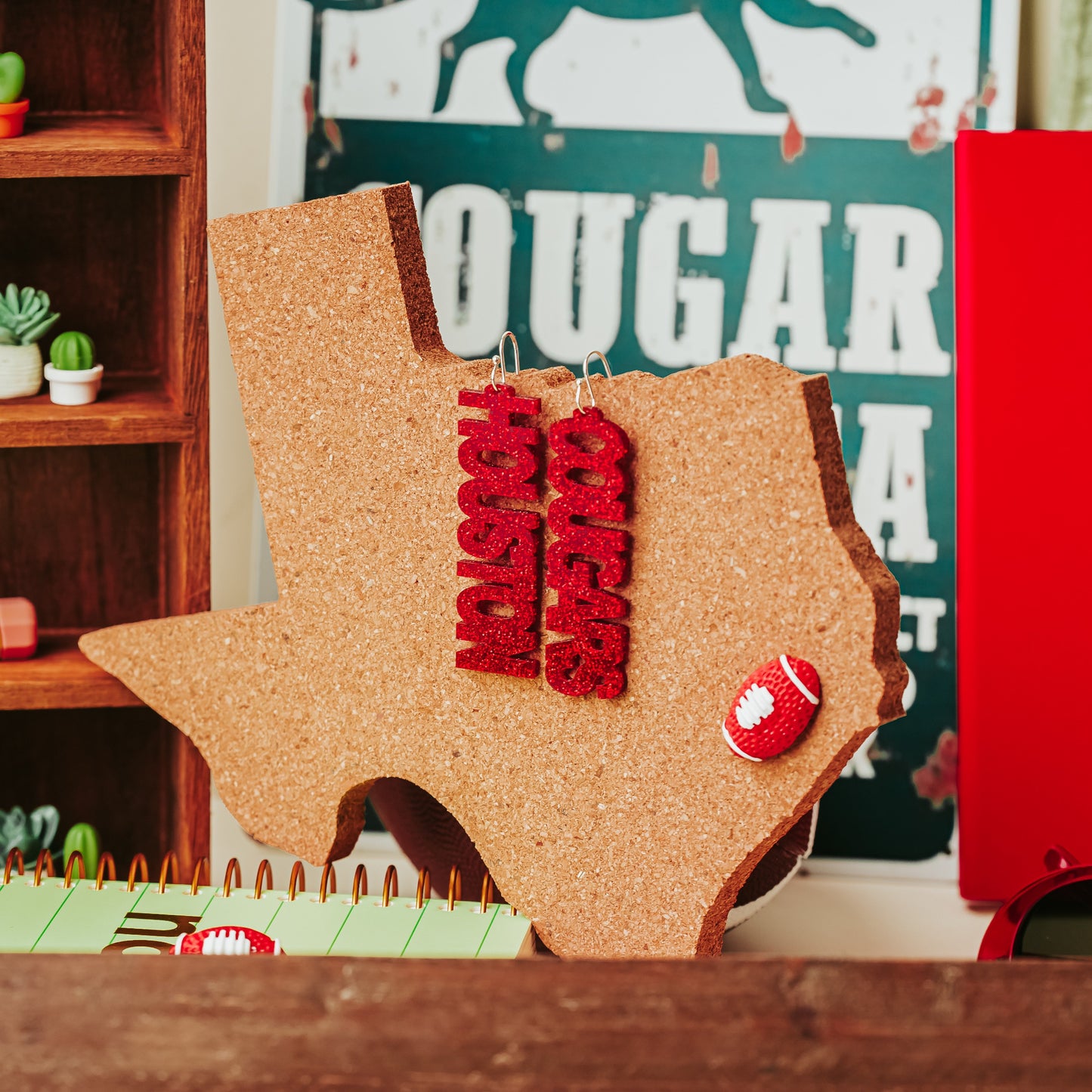 Officially Licensed University of Houston Cougars acrylic dangle earrings in red and white glitter with silver earring hooks by Half Turn Designs.