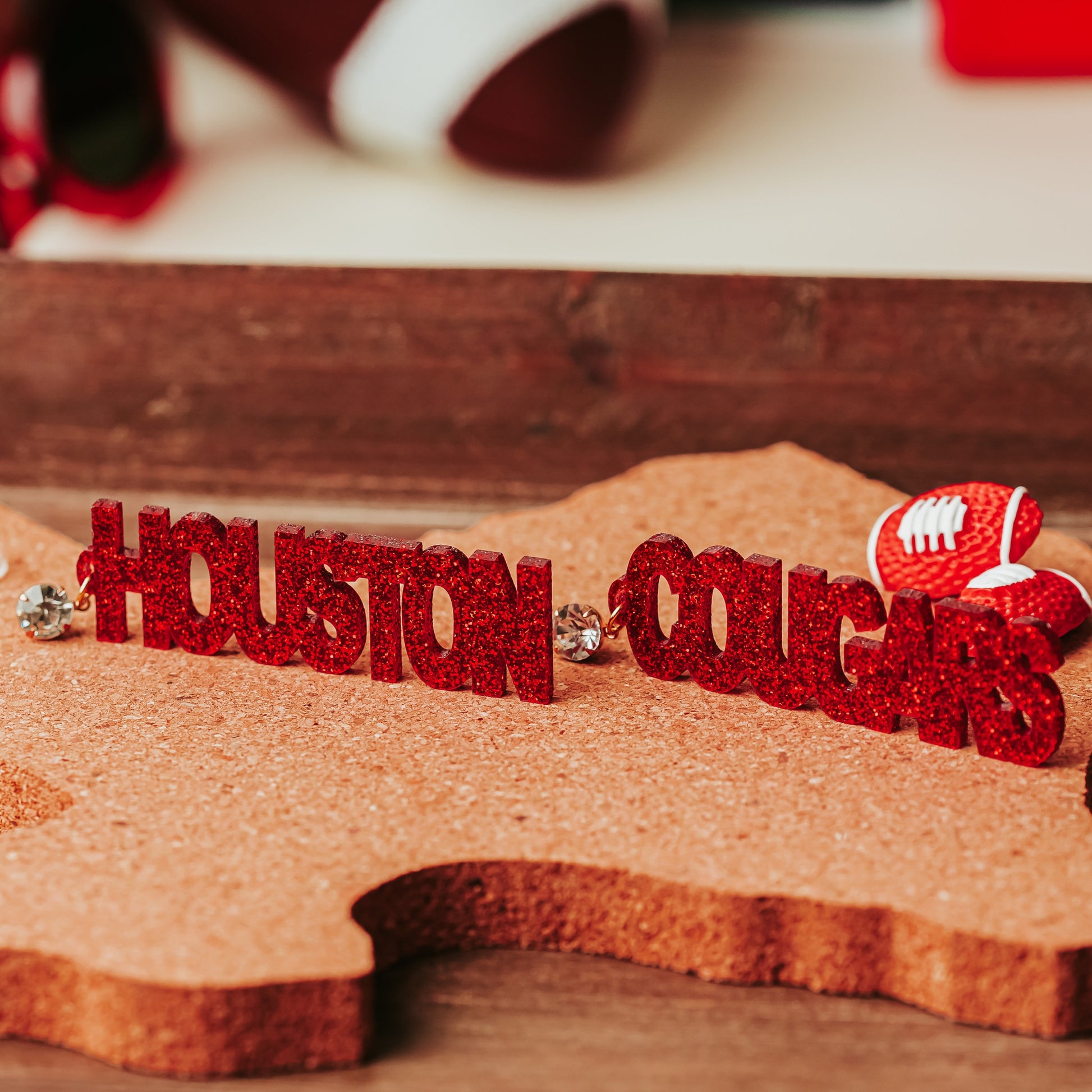 Officially Licensed University of Houston Cougars acrylic dangle earrings in red and white glitter with rhinestone earring toppers by Half Turn Designs.