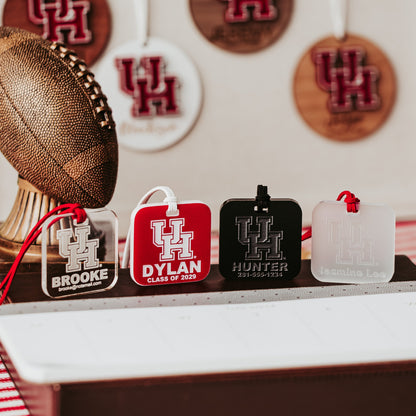 University of Houston Cougars Luggage Tag collection by Half Turn Designs. Square luggage tags available in acrylic options like Black, Clear, Frosted and Red that engraves white.