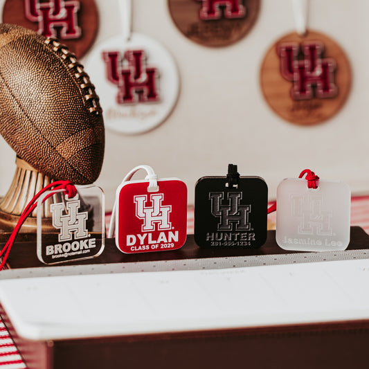 University of Houston Cougars Luggage Tag collection by Half Turn Designs. Square luggage tags available in acrylic options like Black, Clear, Frosted and Red that engraves white.