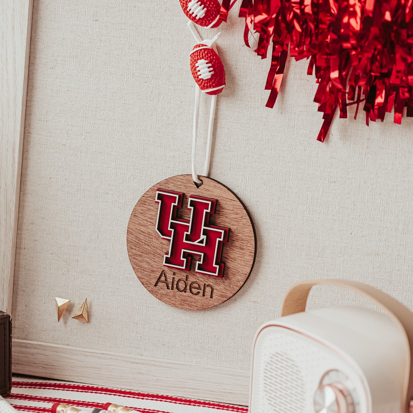 Officially licensed University of Houston personalized ornament by Half Turn Designs in mahogany  wood finish with red and white UH logo.