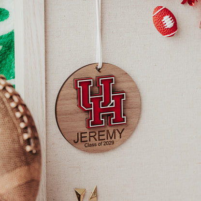 Officially licensed University of Houston personalized ornament by Half Turn Designs in walnut wood finish with red and white UH logo.