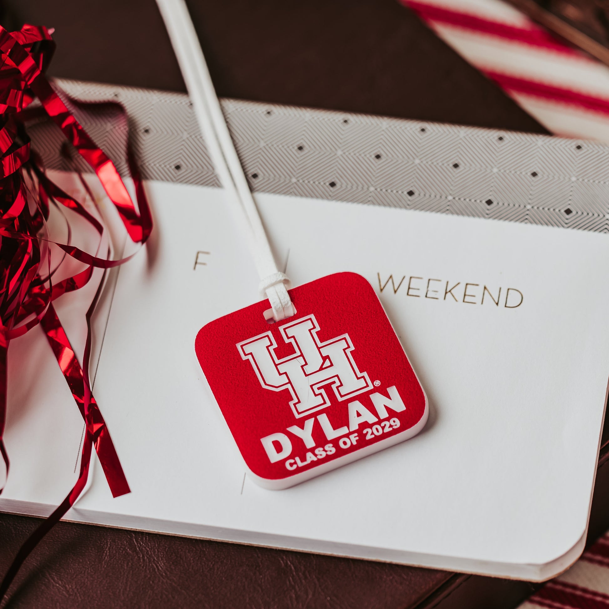 Officially Licensed University of Houston Cougars Luggage Tags by Half Turn Designs. Square luggage tag made from 1/4" red acrylic that engraves white with white cord by Half Turn Designs.