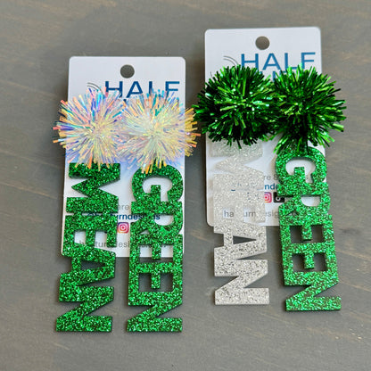 Officially licensed University of North Texas Mean Green Game Day earrings in green and white glitter with your choice of earrings topper including silver earring hooks, rhinestone topper, white tube bead topper, green tinsel topper, iridescent tinsel topper or white tinsel topper.  Mean and Green earrings shown here in green glitter with silver stainless steel earring hooks.  Shown here are mean green earrings with iridescent and green tinsel earring toppers.