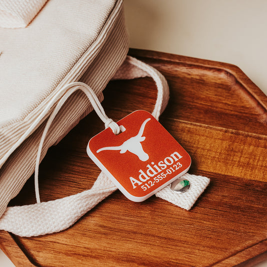 Personalized University of Texas Square luggage tags available in burnt orange acrylic